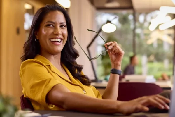Woman smiling sitting on a couch