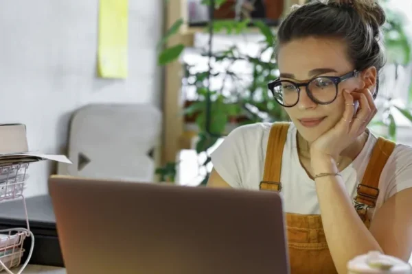 woman working on her laptop at her desk