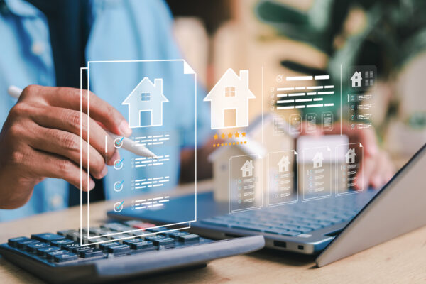 Estate agent reviewing property documents and checklists on a tablet